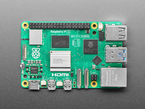 Overhead shot of green credit-card-sized microcontroller.