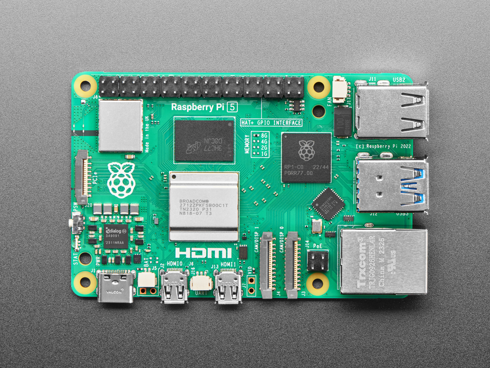Overhead shot of green credit-card-sized microcontroller.
