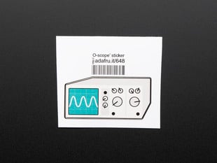 Sticker in the shape of analog oscilloscope in grey with turquoise screen showing sine wave. Mounted on white paper with barcode. 
