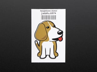 Sticker in the shape of sitting BeagleBone dog logo. Dog is brown and white with red detail for tongue. Mounted on white paper with barcode. 