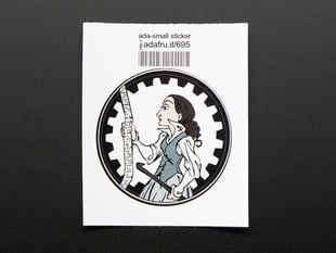 Circular sticker showing a cartoon of Ada Lovelace in profile, holding a crowbar and examining a long ruler, over a white background. Sticker is edged in black gear teeth. Mounted on white paper with barcode