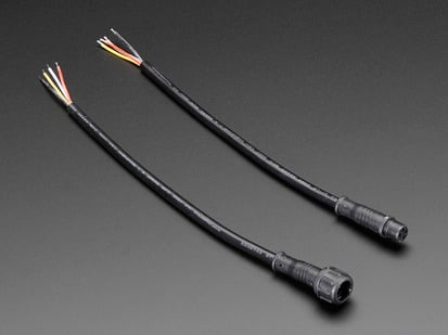 Two black, waterproof, 4-wire cable assemblies.