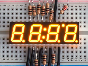 Small yellow 7-segment clock display with all segments lit