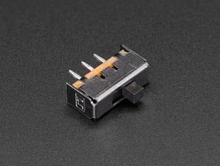 Small, black, SPDT slide switch.