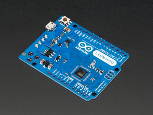 Blue, credit card-sized microcontroller PCB.