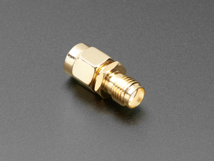 RF adapter with SMA jack and RP-SMA plug.