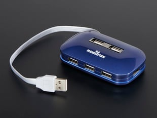 Blue USB hub with seven USB-A ports.
